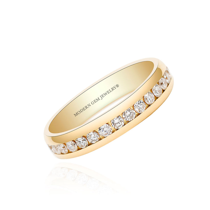 Channel Set Wedding Band in Yellow Gold against a White Background | Modern Gem Jewelry | Saratti