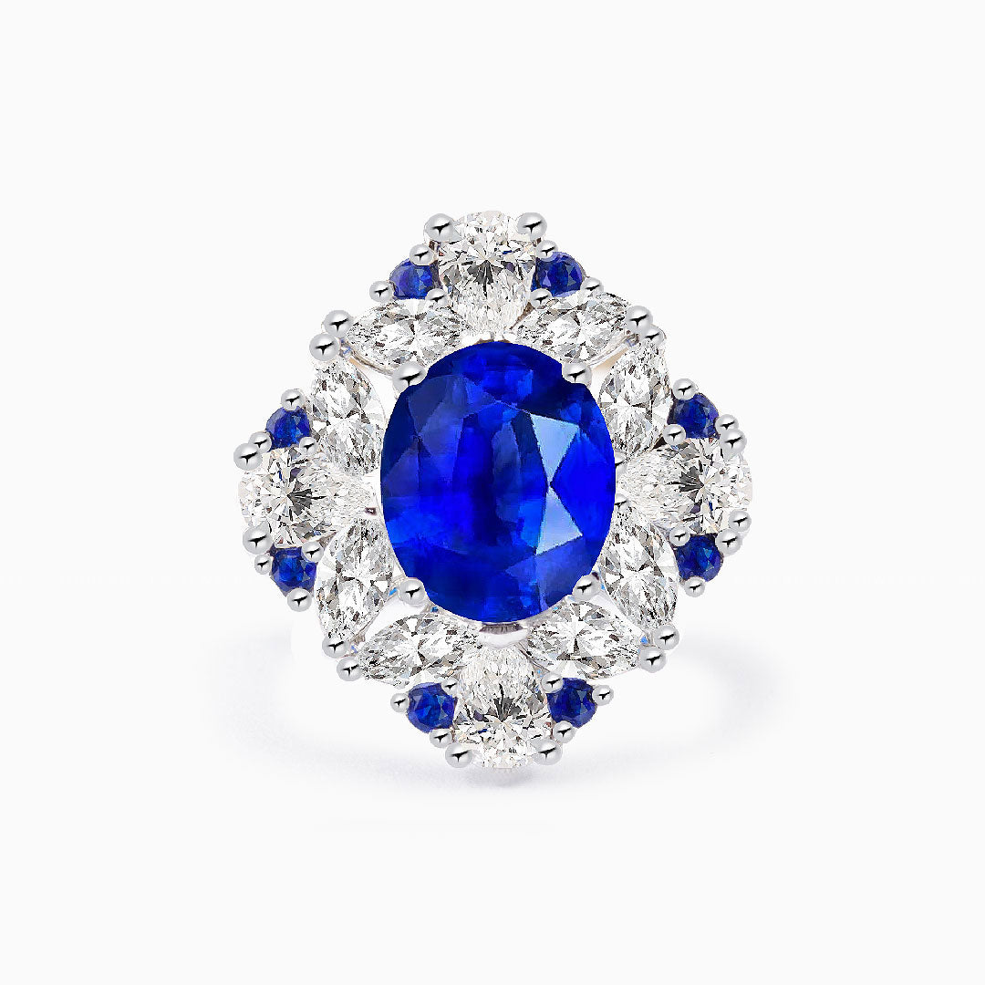 Oval Royal Blue Cocktail Ring with Sapphire and Diamond Accent Stones in 18K White Gold | Saratti 
