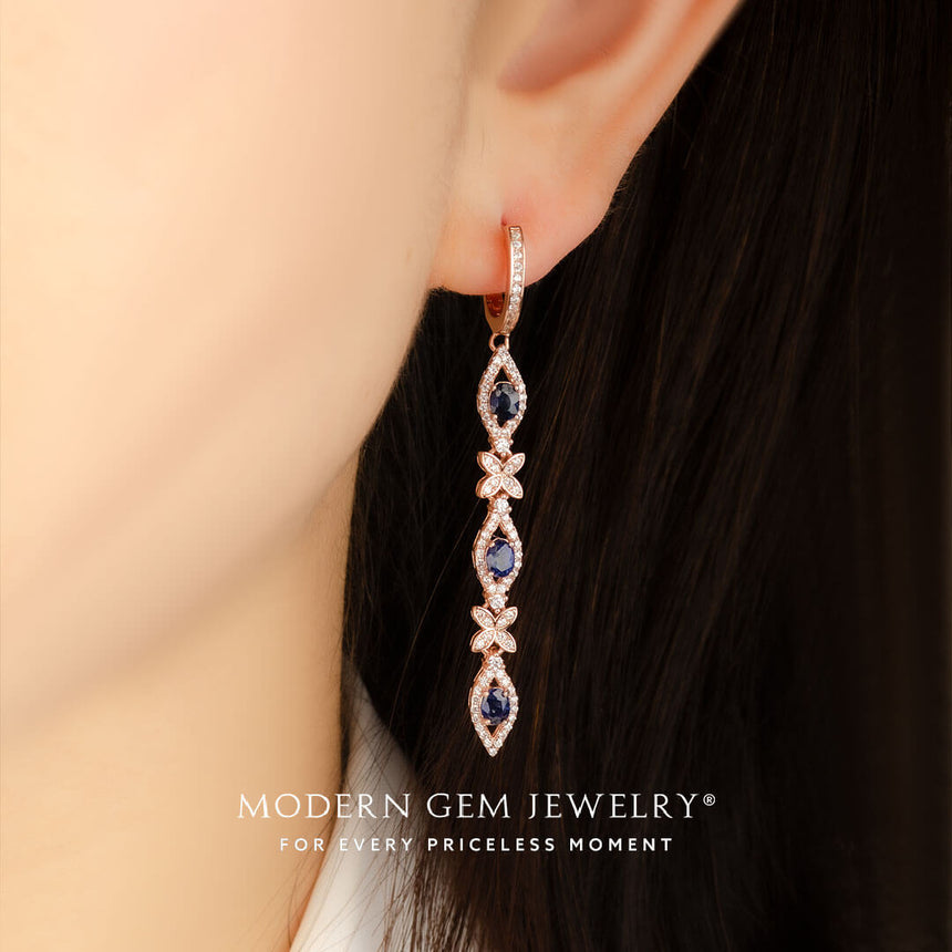 model wears diamond pave sapphire drop earrings