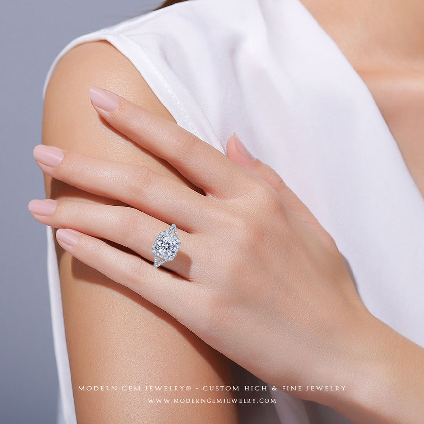 Model wears Split Shank Engagement Diamond Ring Halo  In White Gold |