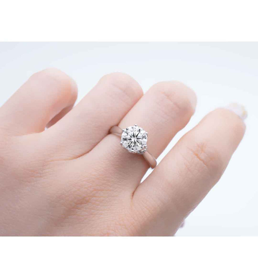 Model wears 18K White Gold Solitaire Moissanite Ring