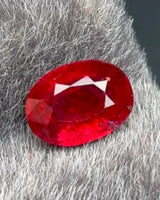 Alternate view of 0.76 CTS Natural red Ruby oval showing balanced proportions and bright modified brilliant faceting | SARATTI