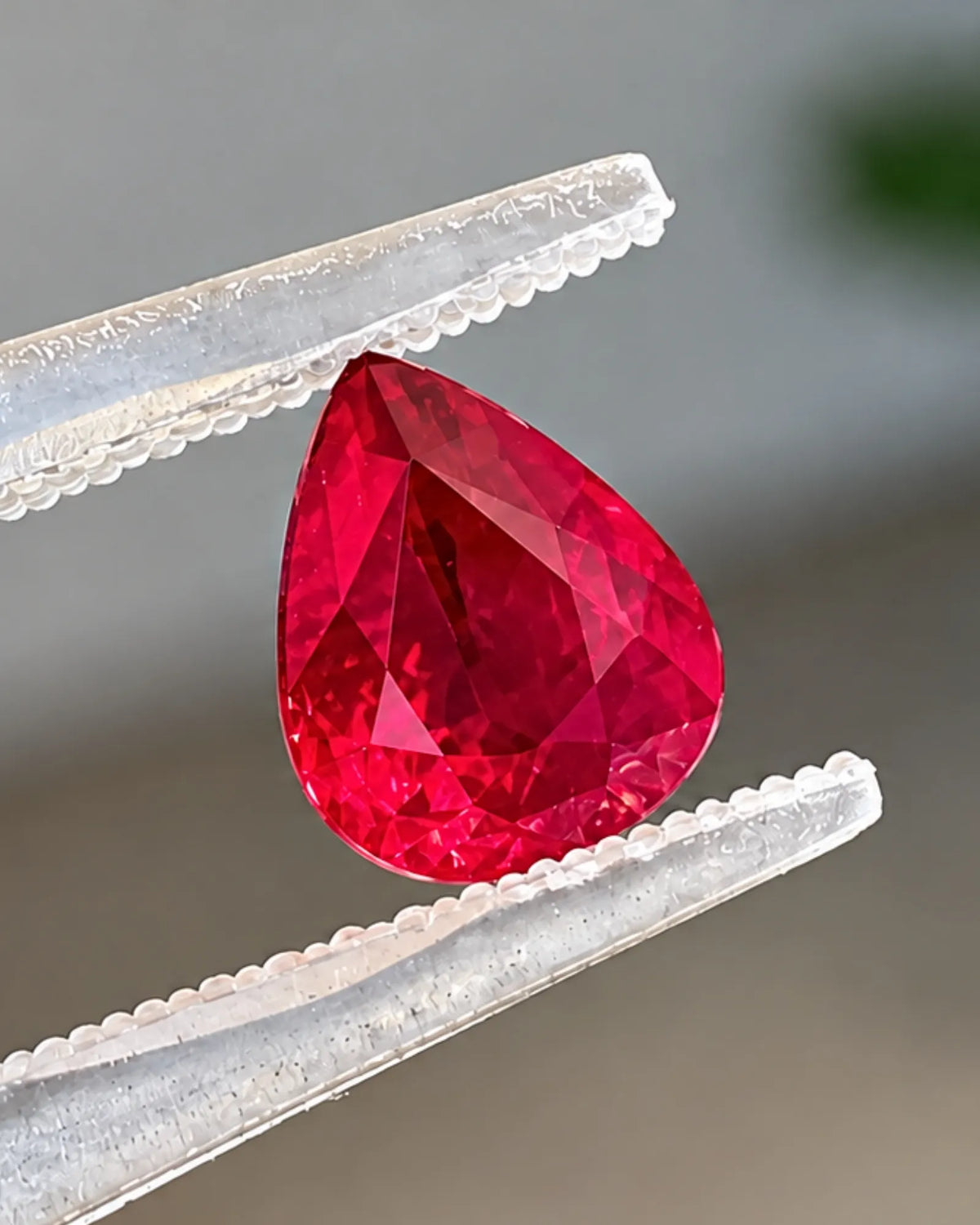 Natural 1.02 CTS Burmese Pigeon Blood Red Ruby pear gemstone shown from an alternate angle | SARATTI
