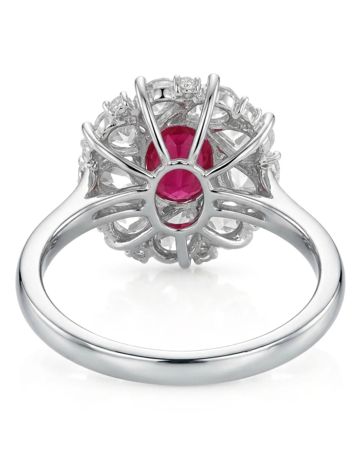 1.02ct oval ruby creates the vivid central focus of the floral composition.
