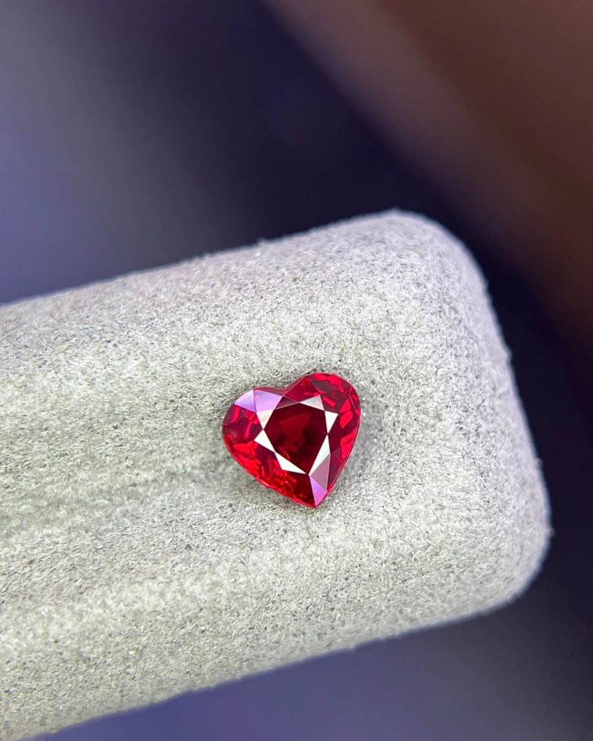 Alternate angle of 1.28 CTS Natural Mozambique vivid red Ruby heart showing defined lobes and point | SARATTI