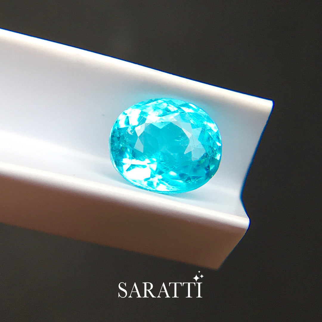 1.31 carat neon blue tourmaline oval cut faceted loose gemstone macro | SARATTI