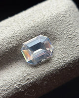 Natural Moonstone octagonal step cut at an angle showing broad geometric facets and cool central reflections | SARATTI