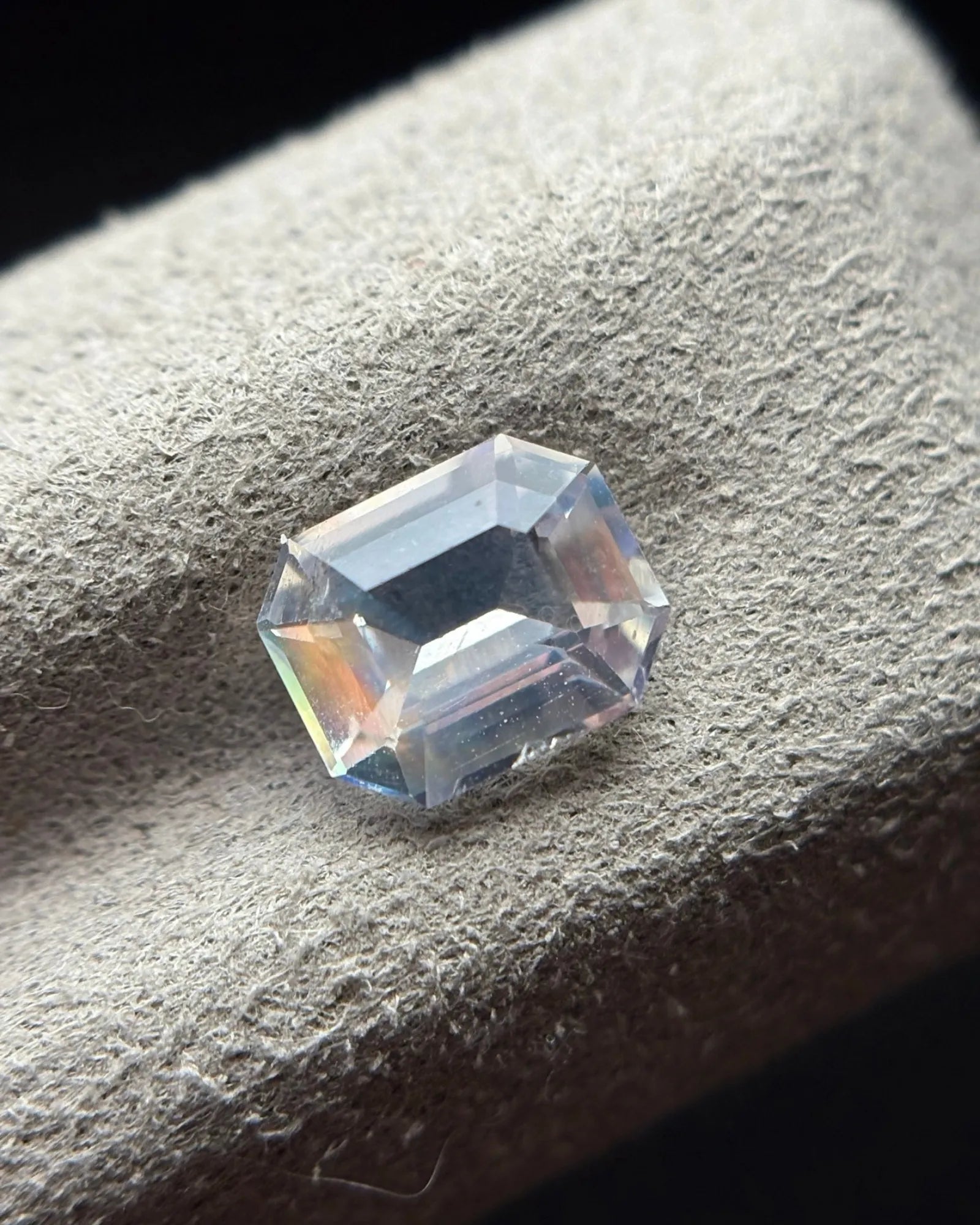 Natural Moonstone octagonal step cut at an angle showing broad geometric facets and cool central reflections | SARATTI