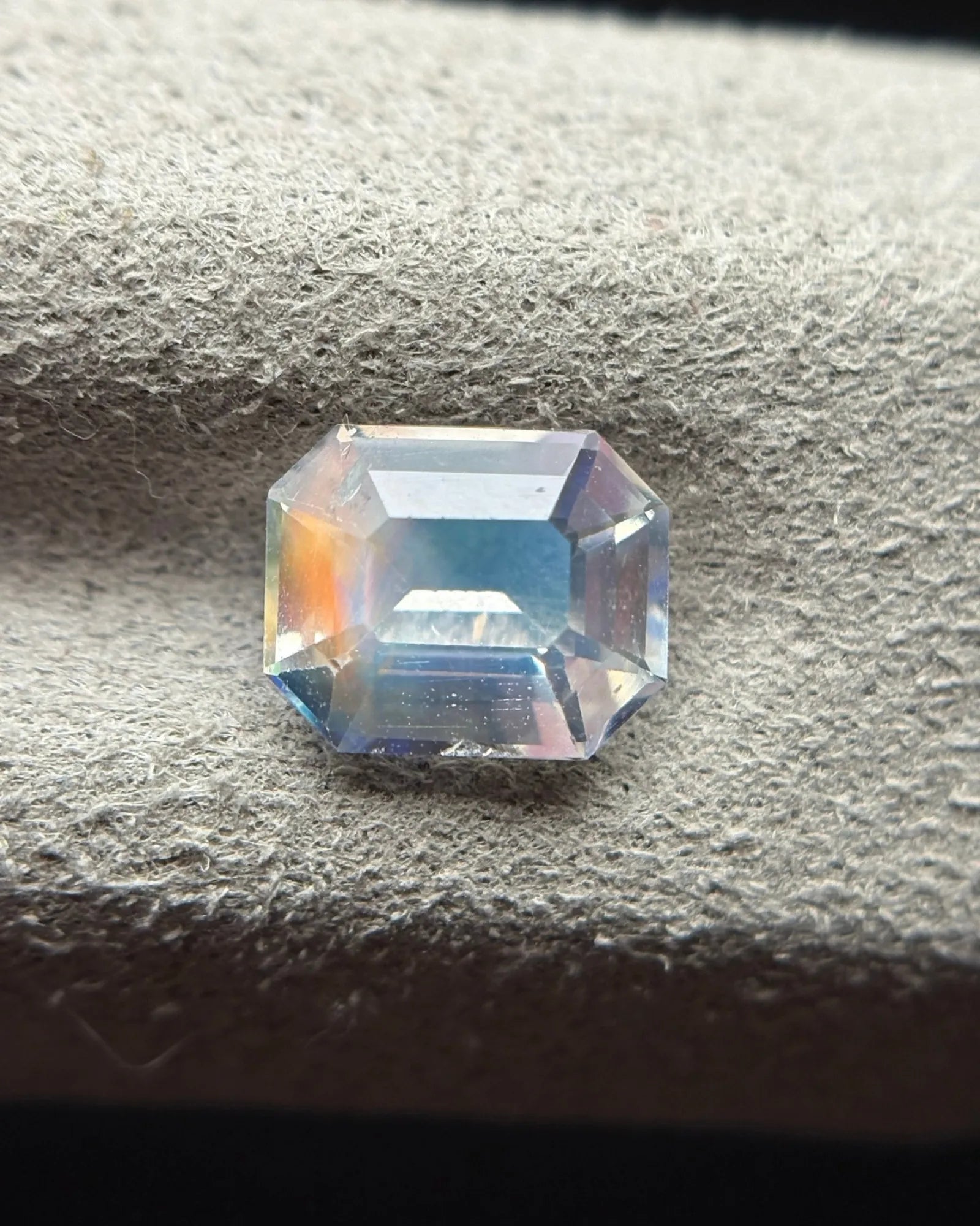 Natural Moonstone octagonal face-up view showing elongated proportions, stepped facets and multicolour reflections | SARATTI