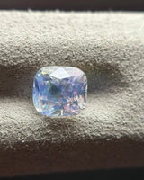 Natural Rainbow Moonstone cushion angled view showing concentrated blue sheen across part of the stone | SARATTI