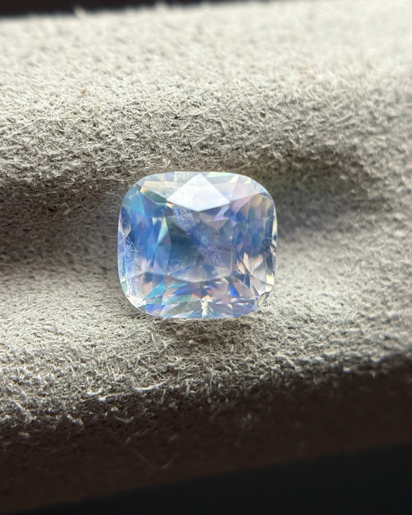 Natural Rainbow Moonstone cushion oblique view highlighting its faceted architecture and visible natural internal character | SARATTI