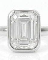Golden Horizon – Natural Emerald-Cut Diamond Bezel Engagement Ring