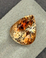 13 × 11mm Brazilian Imperial Topaz pear-shaped front view | SARATTI