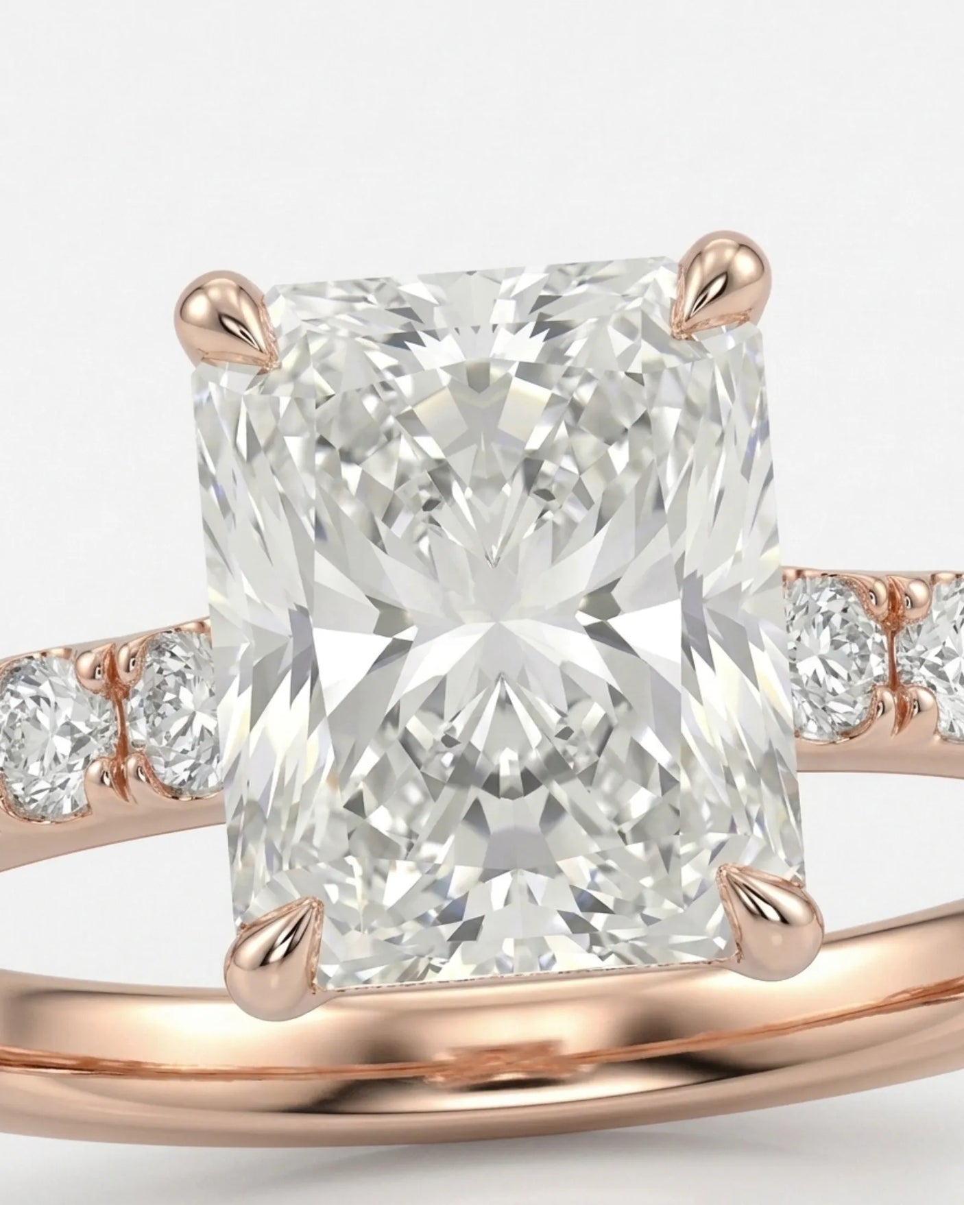 Rose gold moissanite ring with radiant center and refined pavé band | SARATTI