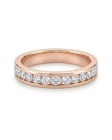 18K rose gold wedding ring set featuring round natural diamonds channel set around the female eternity band | SARATTI
