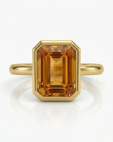 18K yellow gold Imperial Topaz halo setting with orange sapphire accents | SARATTI