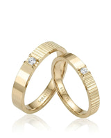 18K yellow gold couple wedding rings featuring natural diamonds and a refined prism-inspired design | SARATTI