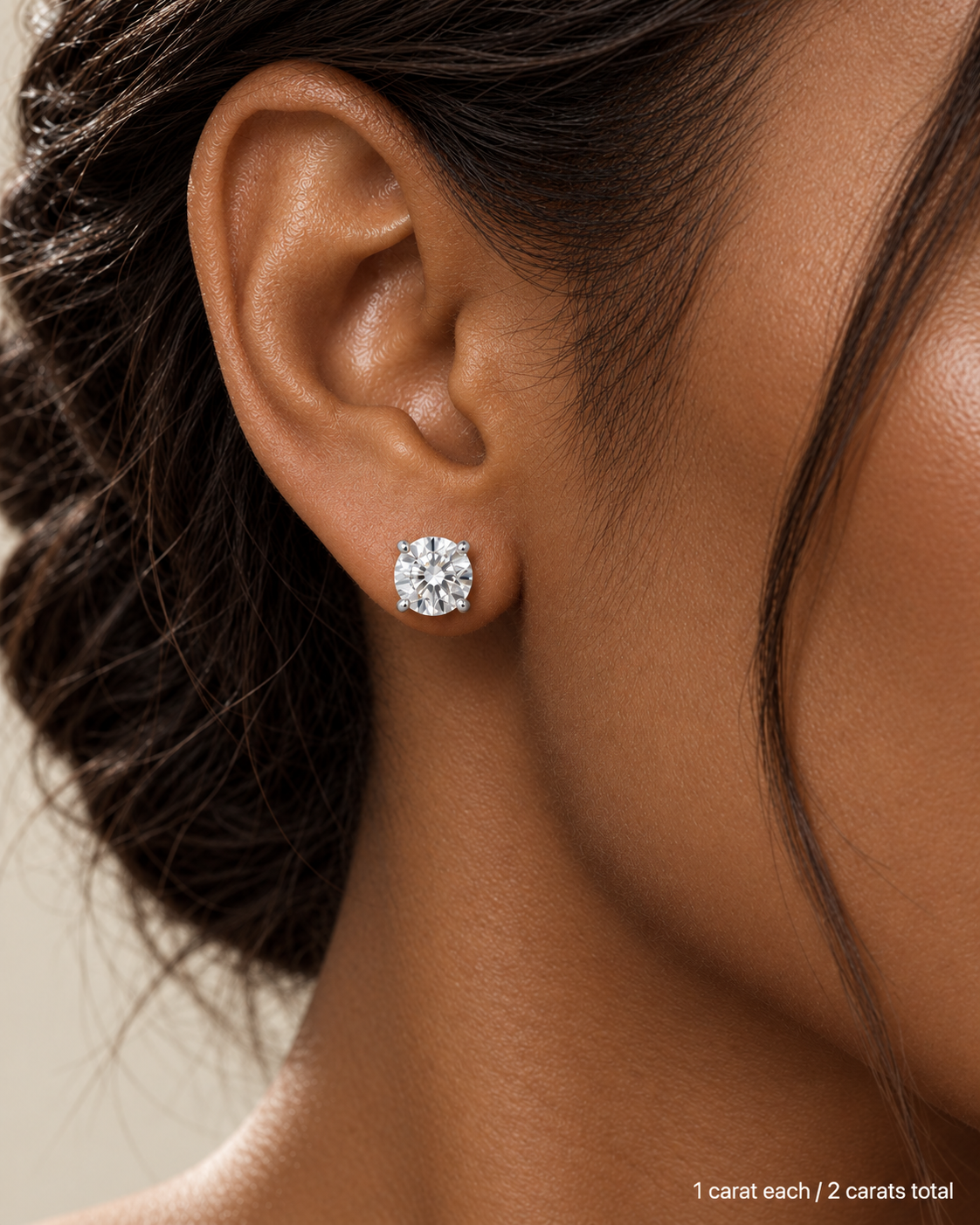 2.00 ct. tw. lab-grown round diamond studs in platinum, deep skin on-ear model | SARATTI