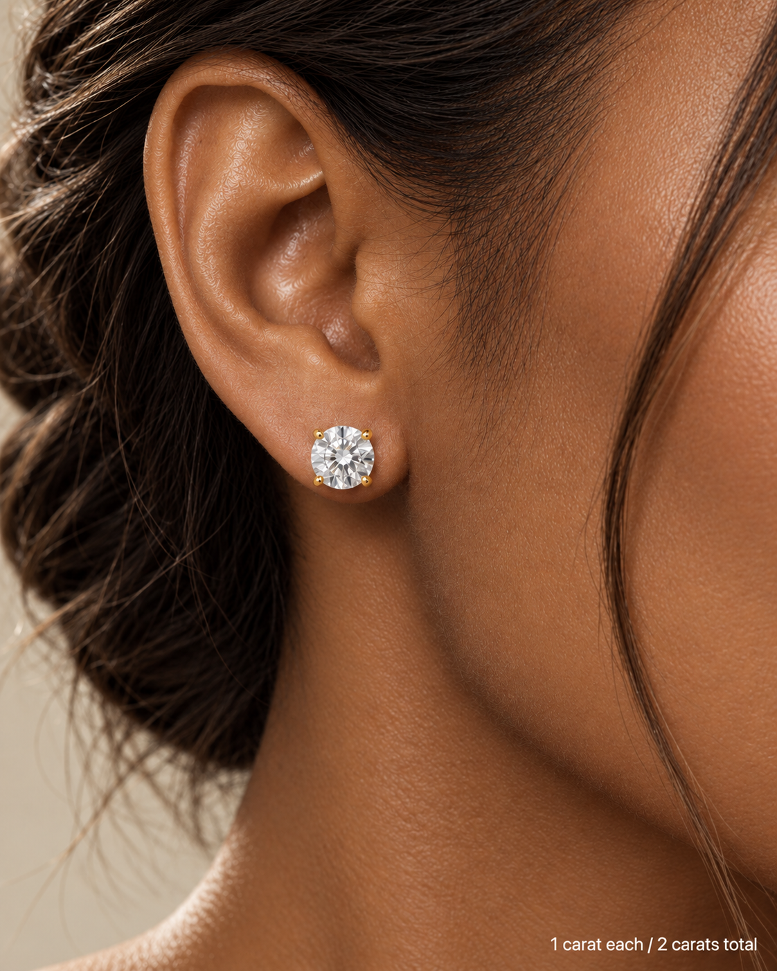 2.00 ct. tw. lab-grown round diamond studs in 18K yellow gold, deep skin on-ear model | SARATTI