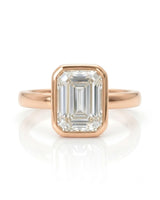 2 carat emerald-cut diamond bezel engagement ring in rose gold, front | SARATTI