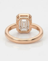 2 carat emerald-cut diamond bezel engagement ring in rose gold, open gallery | SARATTI