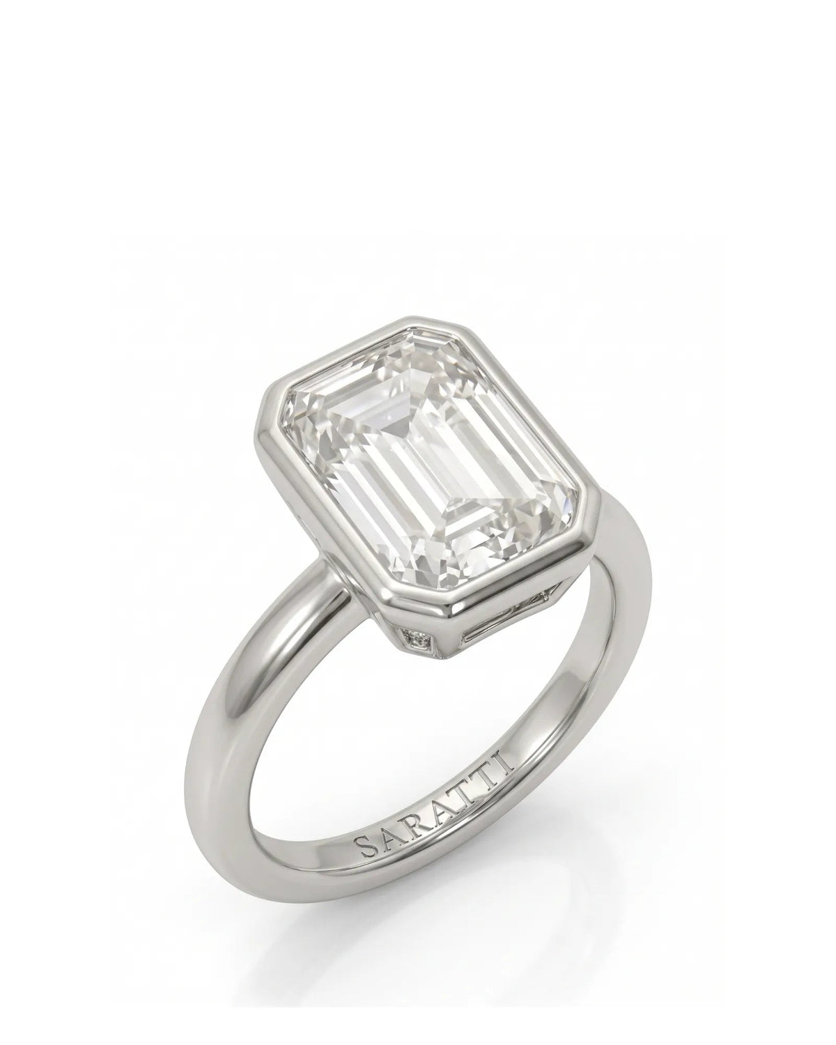 2 carat emerald-cut diamond bezel engagement ring in white gold, 45 degree | SARATTI
