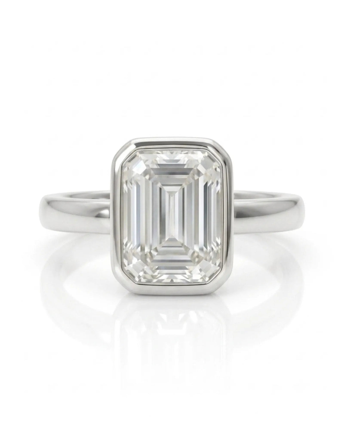 2 carat emerald-cut diamond bezel engagement ring in white gold, front | SARATTI