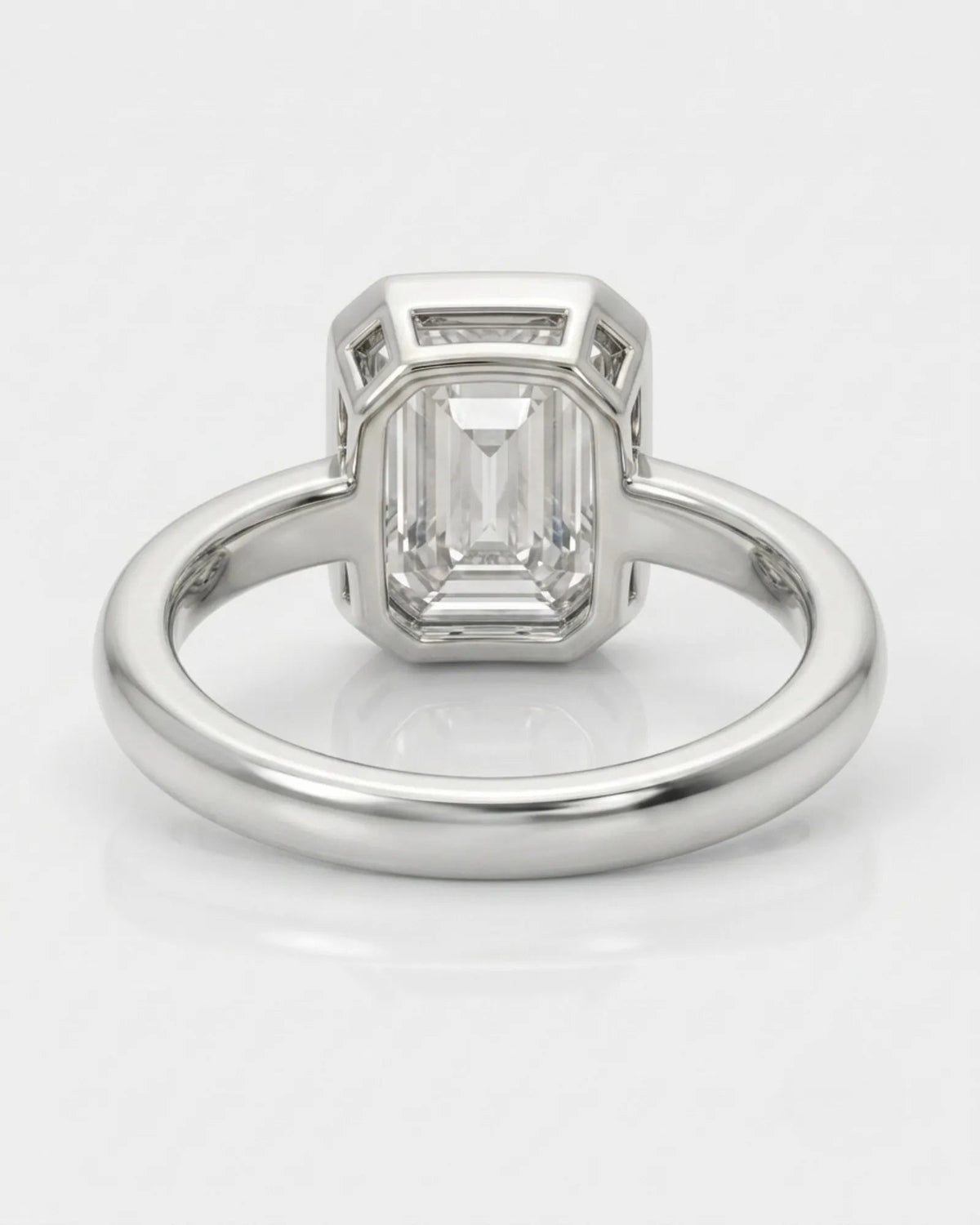 2 carat emerald-cut diamond bezel engagement ring in white gold, open gallery | SARATTI