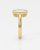 2 carat emerald-cut diamond bezel engagement ring in yellow gold, side profile | SARATTI