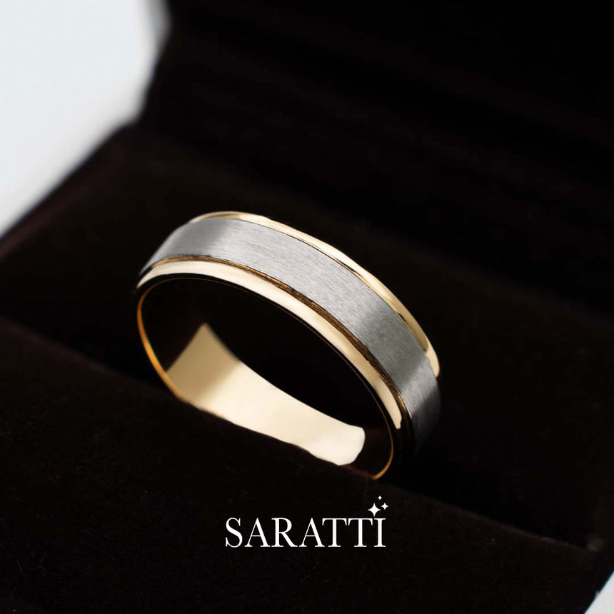 Mens comfort fit wedding band worn on hand in 18K white and yellow gold | SARATTI