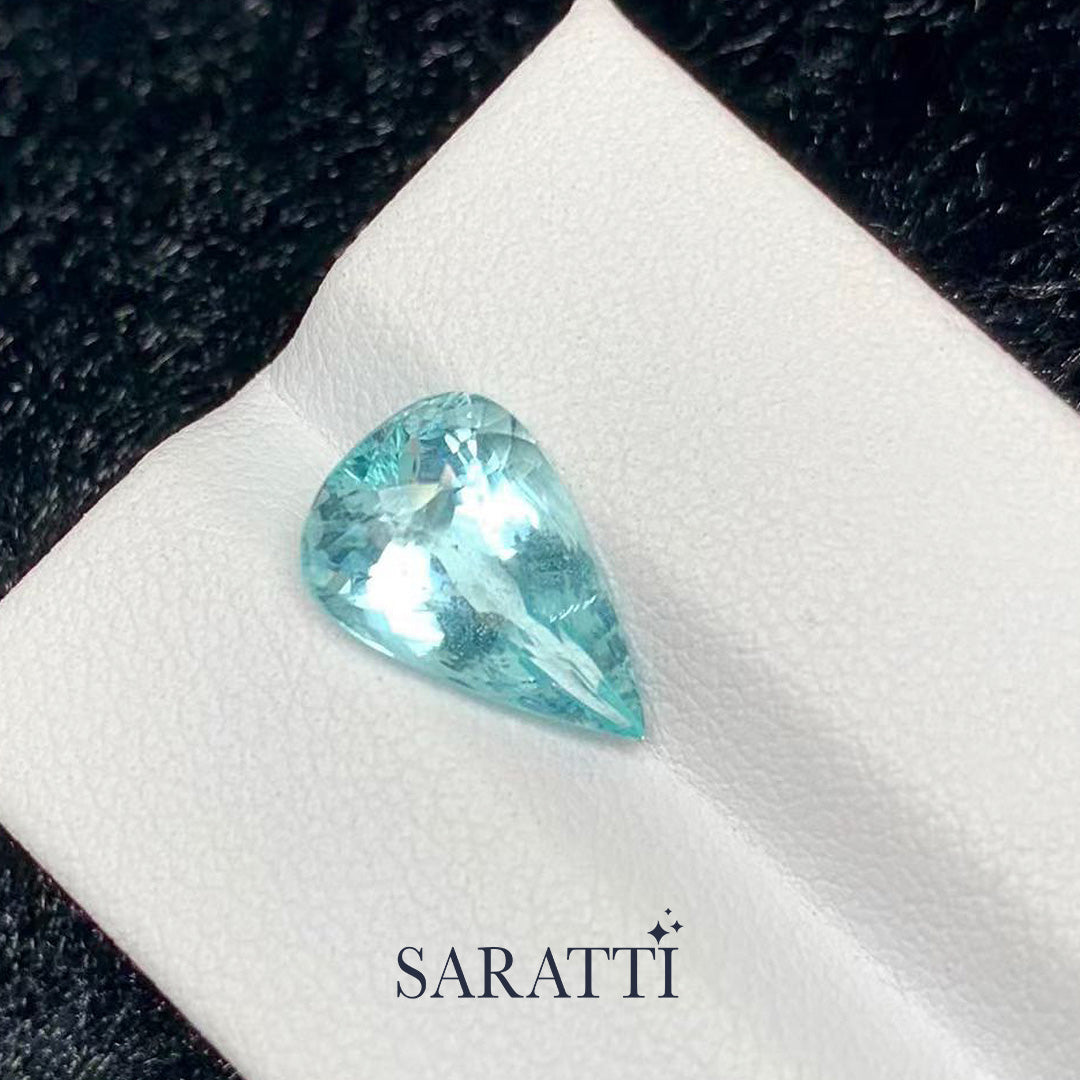 3.28 carat neon light blue tourmaline pear cut faceted loose gemstone macro | SARATTI