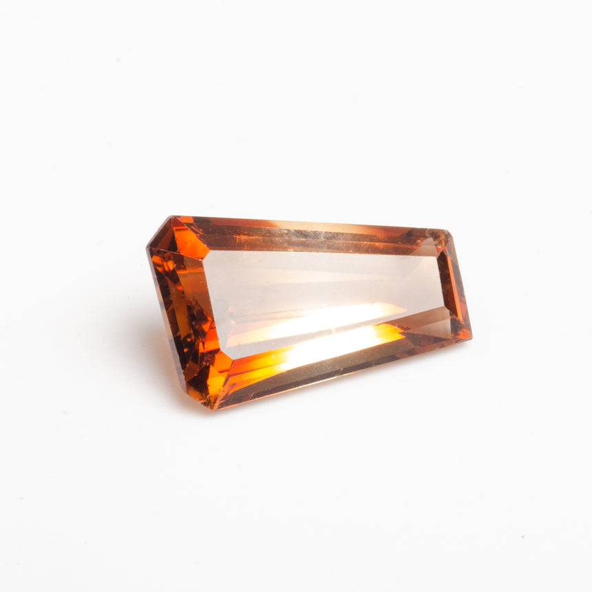 Rectangular orange gemstone on a white background - 9.95ct Imperial Topaz fancy cut golden amber gemstone | SARATTI
