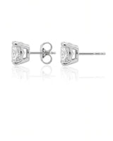 1.00 ct. tw. lab-grown round diamond four-prong studs in platinum, angled view | SARATTI