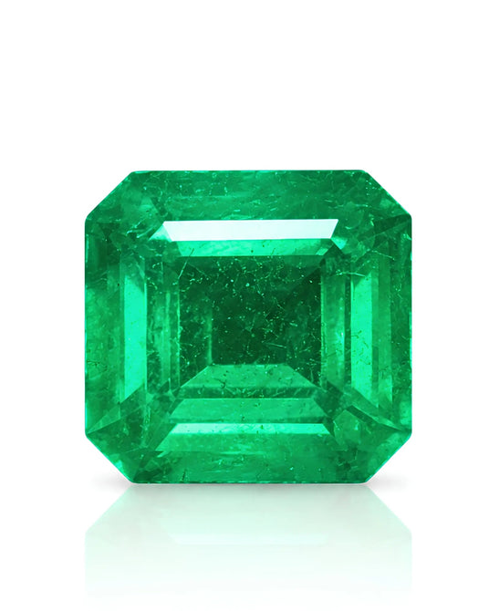 4.95 CTS Natural Vivid Green Emerald, octagonal step cut shown face-up with clipped corners and broad table | SARATTI