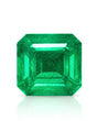 4.95 CTS Natural Vivid Green Emerald, octagonal step cut shown face-up with clipped corners and broad table | SARATTI