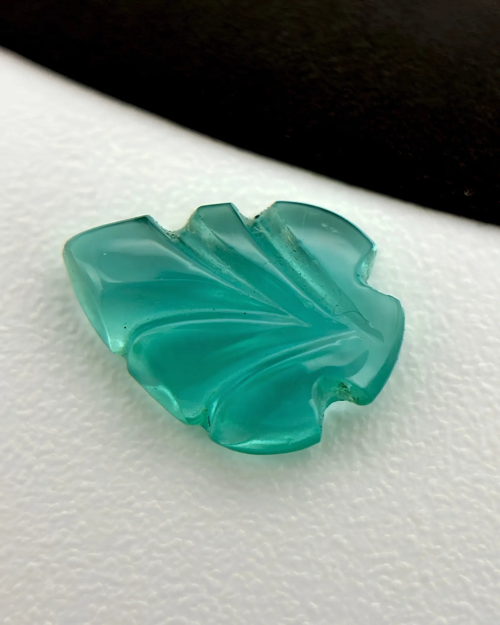 Back view of 0.69ct Natural Emerald carved leaf gemstone | SARATTI