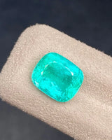 Close-up of 5.01ct Natural Intense Green Emerald Cushion showing Modified Brilliant facet reflections | SARATTI