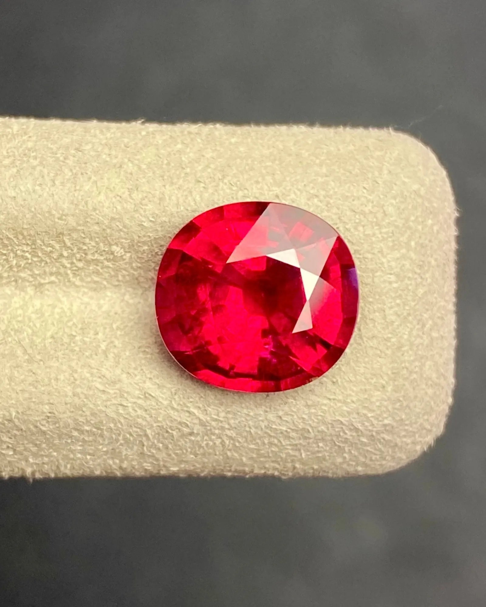Angled view of 5.24ct Natural Rubellite Tourmaline showing oval proportions and bright facets | SARATTI