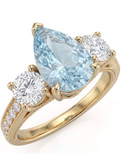 Étoile Trinity pear cut Aquamarine three-stone diamond ring setting in Yellow Gold, front view | SARATTI