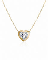SOLARA Bezel-Set Heart Cut solitaire necklace setting in yellow gold, front view | SARATTI