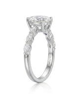 Elegant oval moissanite proposal ring with symmetrical marquise shoulders crafted in 18K white gold -- SARATTI