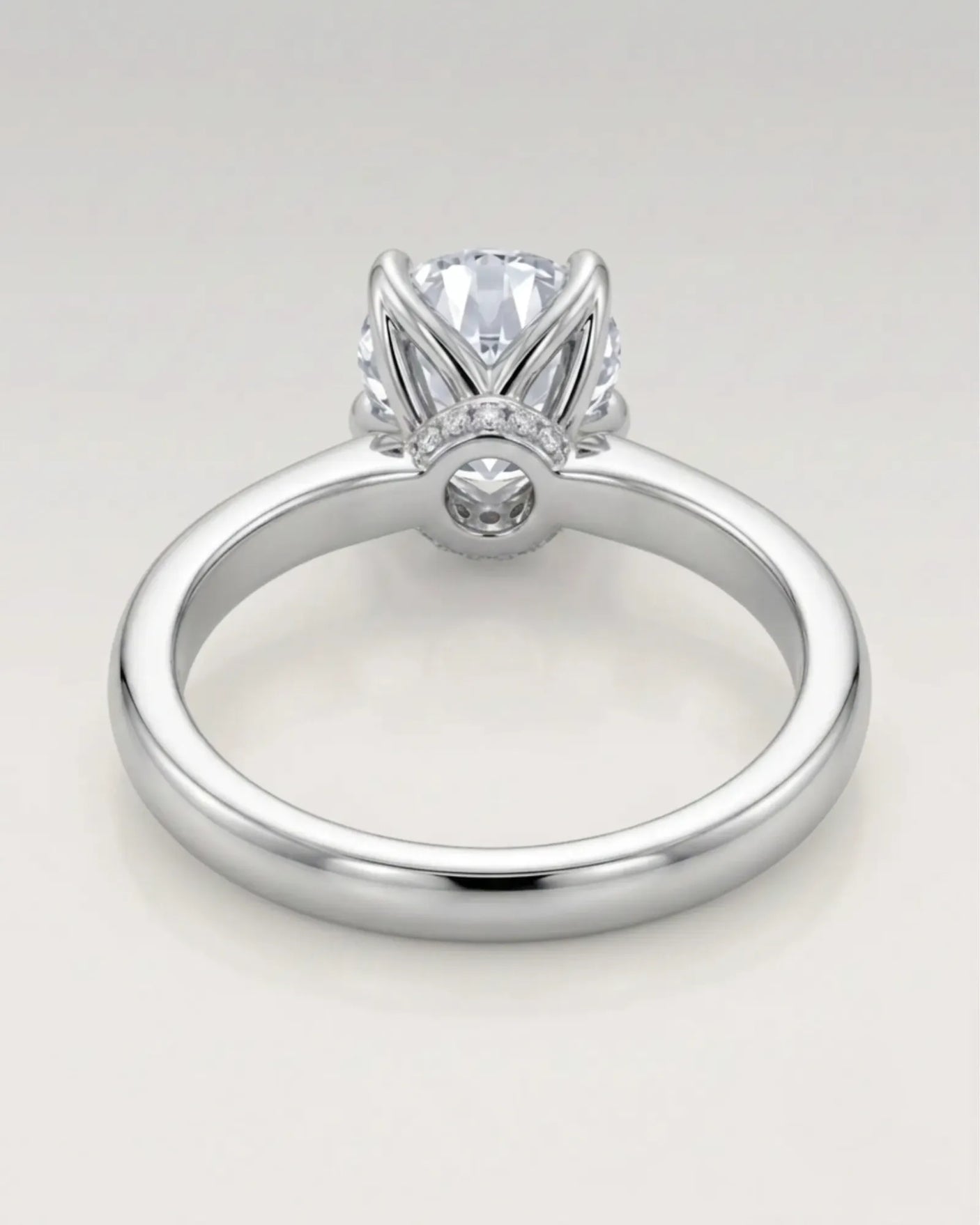 Minimal round moissanite ring with sculptural floral setting and polished 18K White gold band | SARATTI