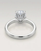 Minimal round moissanite ring with sculptural floral setting and polished 18K White gold band | SARATTI