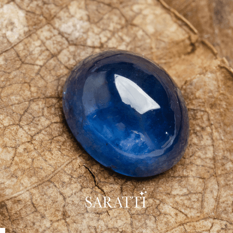 6mm x 5mm sapphire oval cut loose stone photographed on textured surface | SARATTI