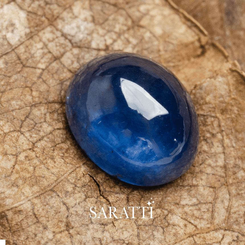 6mm x 5mm sapphire oval cut loose stone photographed on textured surface | SARATTI