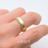 Mens sapphire wedding band worn on hand in 18K yellow gold | SARATTI