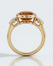 Elevated setting allows light to move through the center gemstone in yellow gold | SARATTI