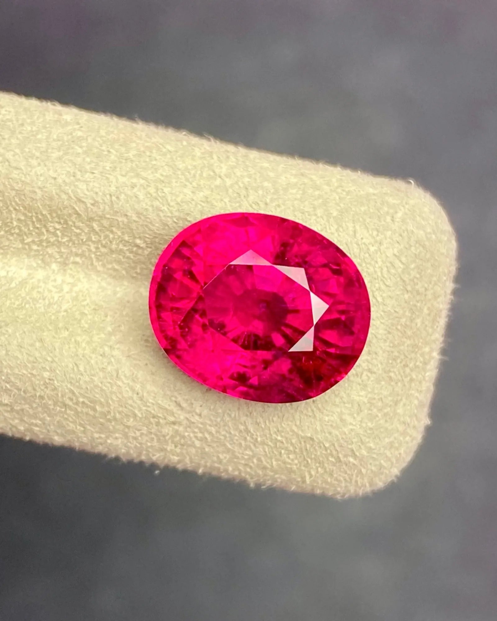 Natural pinkish red Rubellite Tourmaline oval loose gemstone in alternate face-up view | SARATTI
