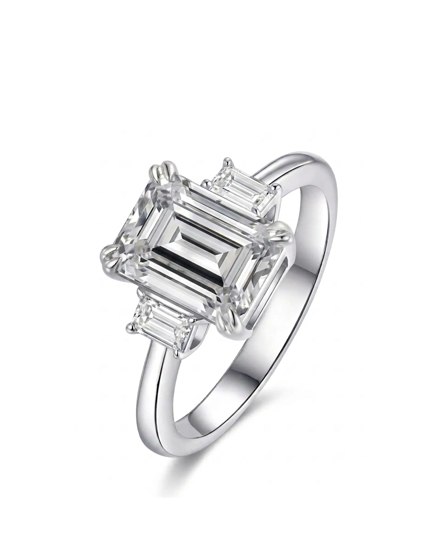 Alma emerald-cut diamond three-stone engagement ring with step-cut side diamond in polished platinum - SARATTI