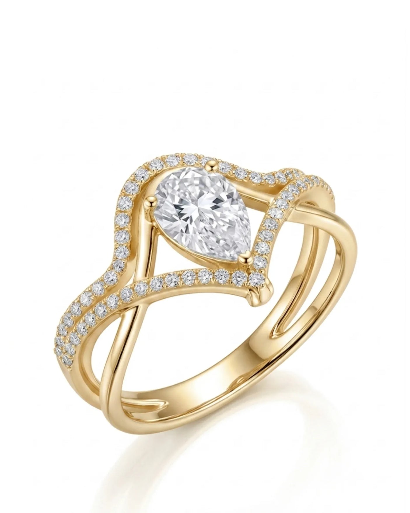 Amara pear-cut moissanite bridal set with flowing bands and round accents in 18K yellow gold | SARATTI